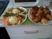 Fried chicken cutlets and fresh steamed vegetables